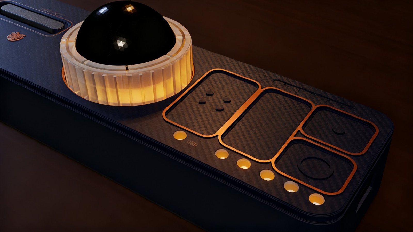 The O.R.B. 2 click cluster — three raised-outline touch pads beside the ring, amber dots along the front edge
